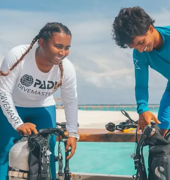 PADI Divemaster preparing diving equipment